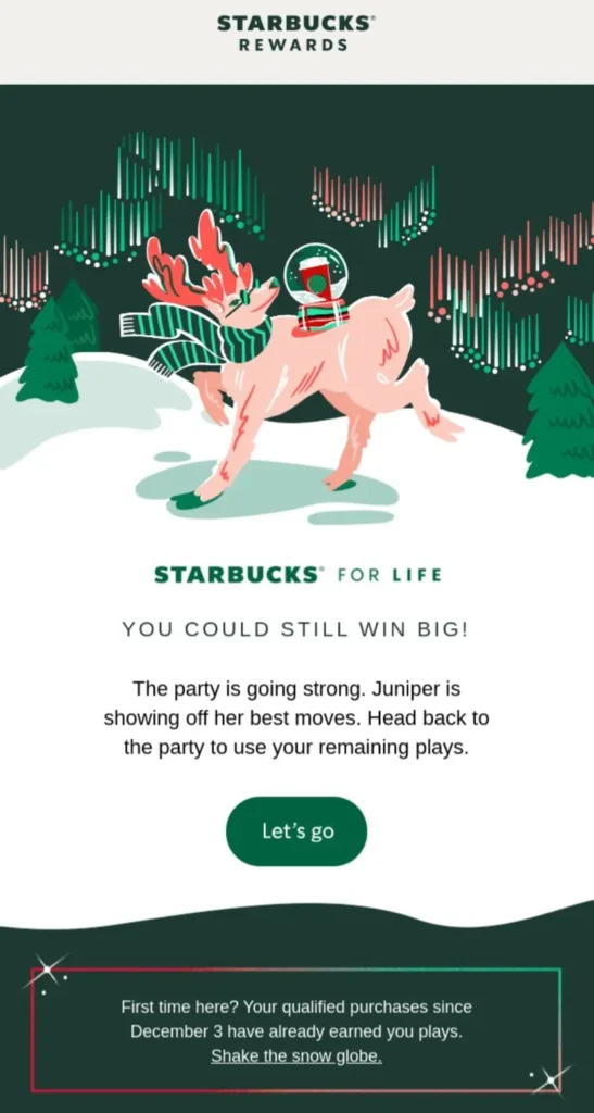 A holiday email campaign by Starbucks with a pink reindeer under northern lights.