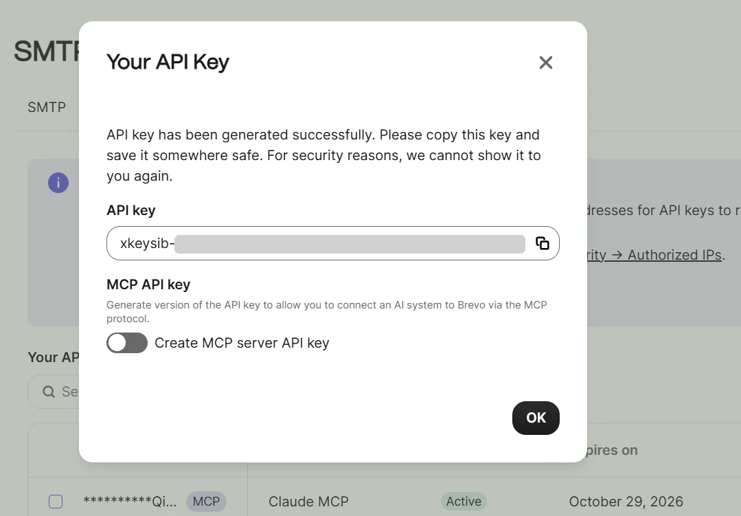 Brevo dialog with a new API key masked after xkeysib-, a copy button and an MCP key toggle